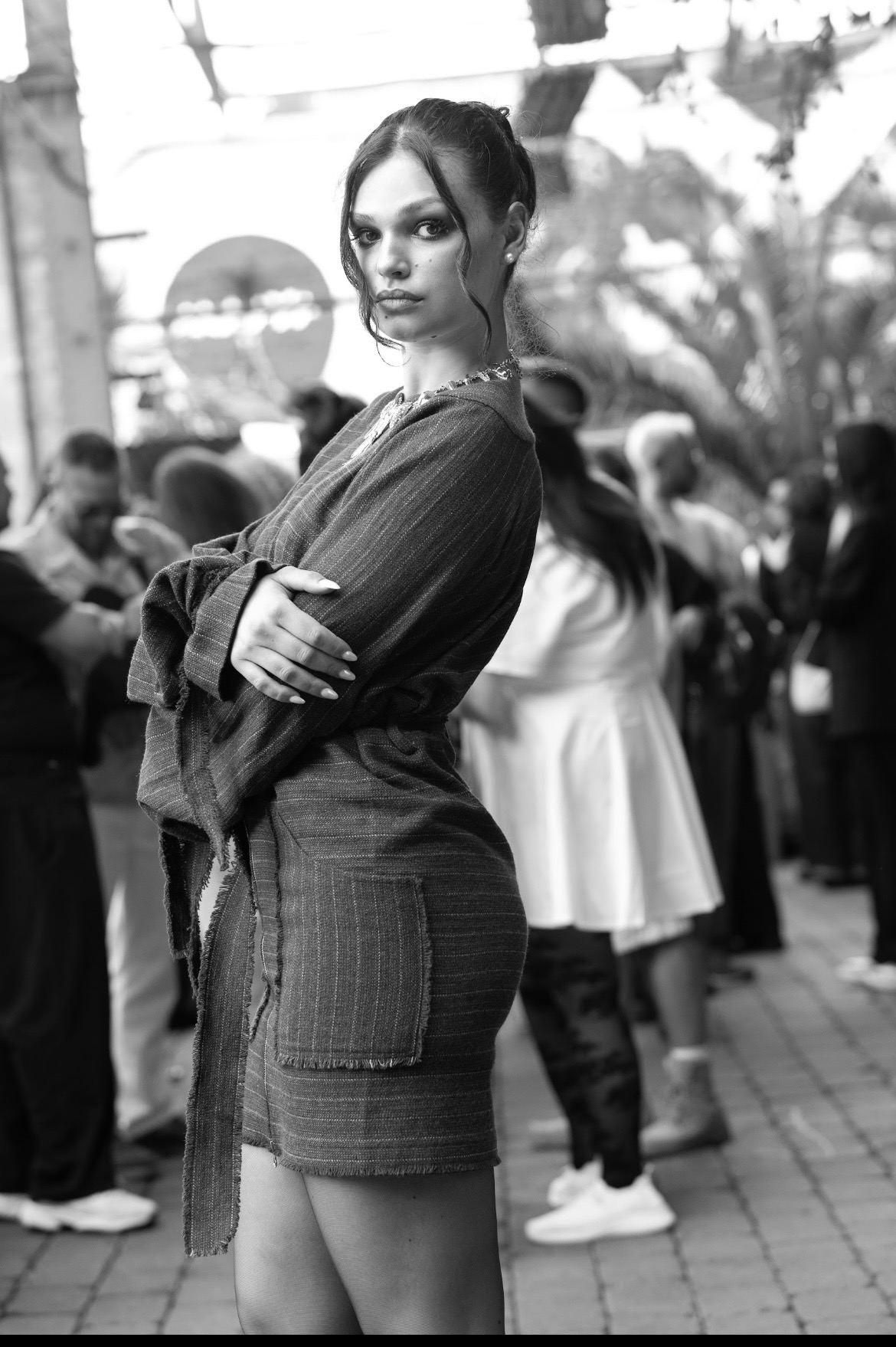 Adeline Frickel in a tweed ensemble photographed in black and white outdoors